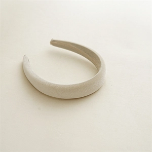 Detail showing plush beige velvet texture on thick padded sponge headband for women