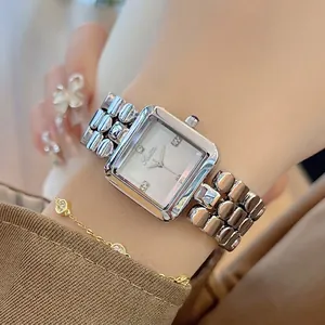 Elegant square silver quartz watch with mother of pearl dial and rhinestone markers