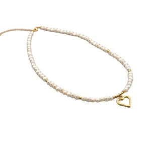 Freshwater pearl necklace with gold heart pendant on white background for women