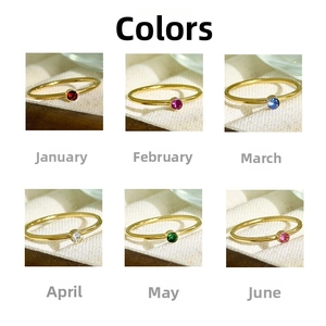 Detailed grid of 18K gold plated birthstone rings featuring colorful round zirconias