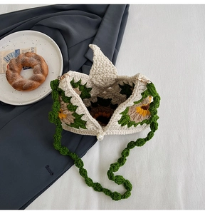 Detail of crochet sunflower tote showing pearl clasp closure and textured hand-knit pattern