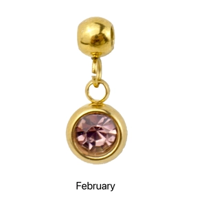 Macro shot of gold pendant with pink stone for February birthstone jewelry making