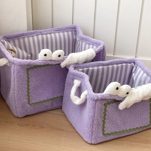 Two-piece purple monster plush storage baskets with googly eyes for home organization