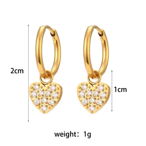 Detailed view of 18K gold earrings with heart charms and size dimensions at 2cm height