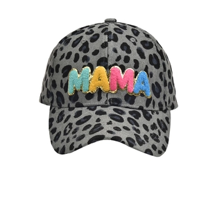 Detail of colorful MAMA chenille patches on a grey leopard print corduroy baseball cap