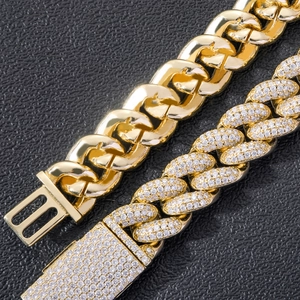 Detailed comparison of 20mm Cuban links in polished gold and iced out zircon pave finishes