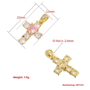 Macro detail of gold-plated cross heart pendant with pink zircon and dimensions