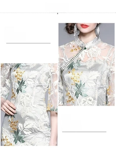 Detail of floral embroidery and sequin embellishments on a grey cheongsam dress