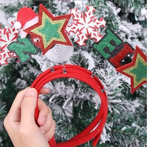 Red Christmas headband with felt stars, snowflakes, and festive hat for holiday party decor