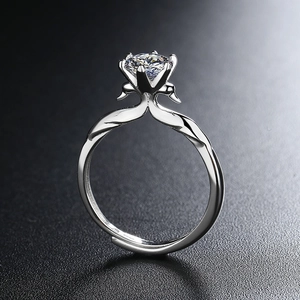 Swan design silver adjustable ring featuring a brilliant round cubic zirconia solitaire