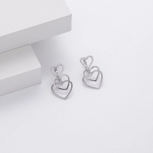 Macro shot of S925 sterling silver triple heart earrings with cubic zirconia stones
