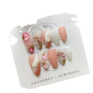 Handmade press-on nails with 3D white roses and pearl accents in long almond shape