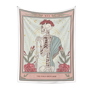 Detail of bohemian tarot tapestry featuring skull, rose wreath, and The Cold Shoulder text