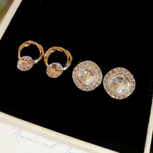 French style gold plated sterling silver earrings with round zircon and hollow spiral design