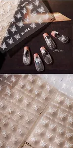Detail of 3D embossed white butterfly nail stickers and M-454 holographic nail art decals