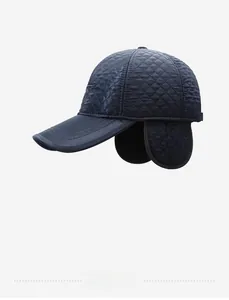 Detail view of winter baseball cap with diamond quilting and ear flaps for men