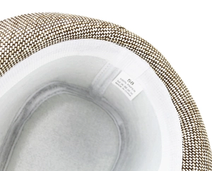 Close-up of the internal straw weave texture, sweatband and size label on the panama hat