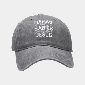 Detail of washed cotton baseball cap featuring vintage texture and printed slogan text