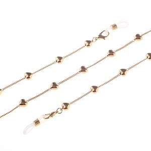Detail of golden heart glasses chain with lobster clasp and silicone anti-slip loops