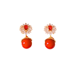 Vintage style gold earrings with zircon flowers and suspended red coral beads on white base