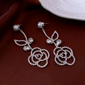 Silver needle drop earrings with pearl and crystal camellia floral design for women