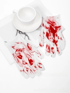 Detailed view of bloody splatter pattern on white Halloween cosplay costume gloves