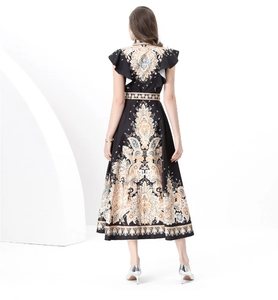Back view of paisley print dress featuring ruffle sleeves and flared hemline
