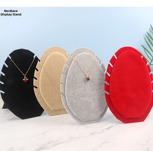 Velvet necklace display stands in multiple colors featuring jagged notches for jewelry