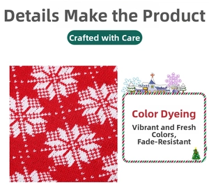 Detail view of red knitted Christmas stocking fabric with white jacquard snowflake pattern