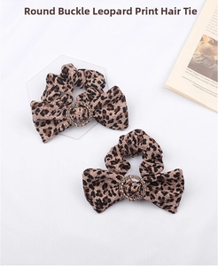 Detail of leopard print scrunchies with bow design and rhinestone encrusted buckle