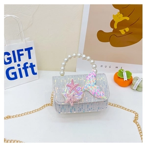 Detail of girl's mermaid crossbody bag with pearl handle and sparkling sequins