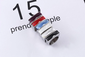 Macro detail of rectangle gemstone rings in six vibrant colors with stainless steel bands