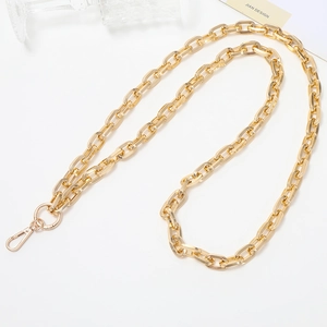 Detail of a shiny gold metal chain strap with lobster clasps for phone cases and bags