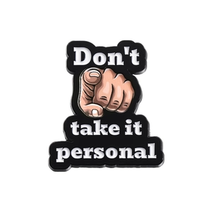 Funny enamel pin featuring pointing finger and Don't take it personal slogan
