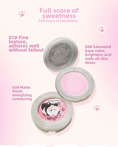 Close-up of matte powder blush compacts with cute panda and elf lid designs