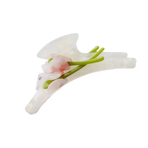 Elegant acetate calla lily hair claw clip with 3D pink flower and green leaves on white
