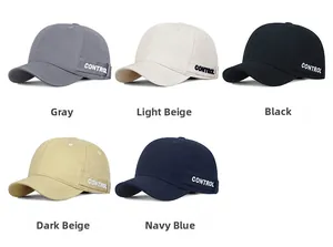 Multiple colors of cotton baseball caps showing side tape detail in a minimalist layout