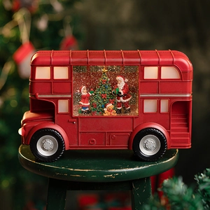 Red Christmas double-decker bus light featuring Santa Claus and sparkling snow globes