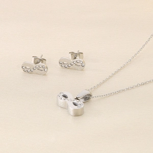 Detailed close-up of 18k silver plated infinity symbol jewelry set with sparkling crystals