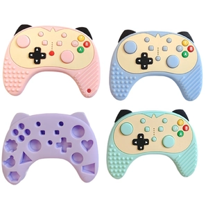 Macro shot of gaming controller shaped silicone molds in four pastel colors