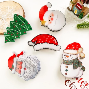 Close-up of a 5-piece Christmas hair claw set with Santa, Snowman, and Tree designs