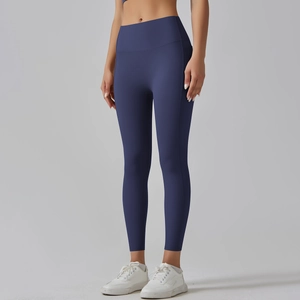 Detail of high-waist seamless yoga pants in navy blue with flatlock stitching for support