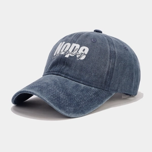 Close-up of deep blue washed denim baseball cap with white NOPE not today embroidery