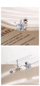 Macro detail of starburst ear studs with blue heart stone and screw-back closure