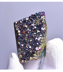 Macro shot of titanium coated rainbow crystal cluster with vibrant metallic luster