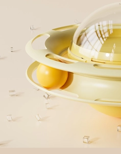 Detail macro of multi-layer yellow cat feeder toy with rotating track and puzzle balls