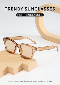 Detail of trendy amber square sunglasses on beige geometric props for a fashion look