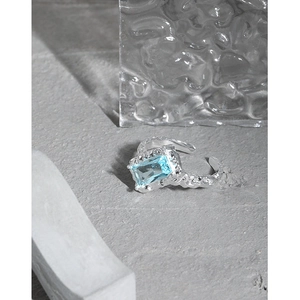 Minimalist S925 silver open ring with light blue rectangle zircon and lava texture