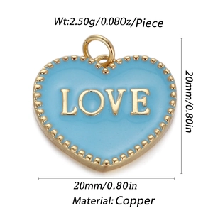 Close-up of a 20mm light blue enamel heart charm with LOVE text and brass details