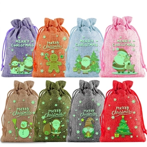 Set of 8 luminous Christmas burlap drawstring gift bags with colorful festive designs